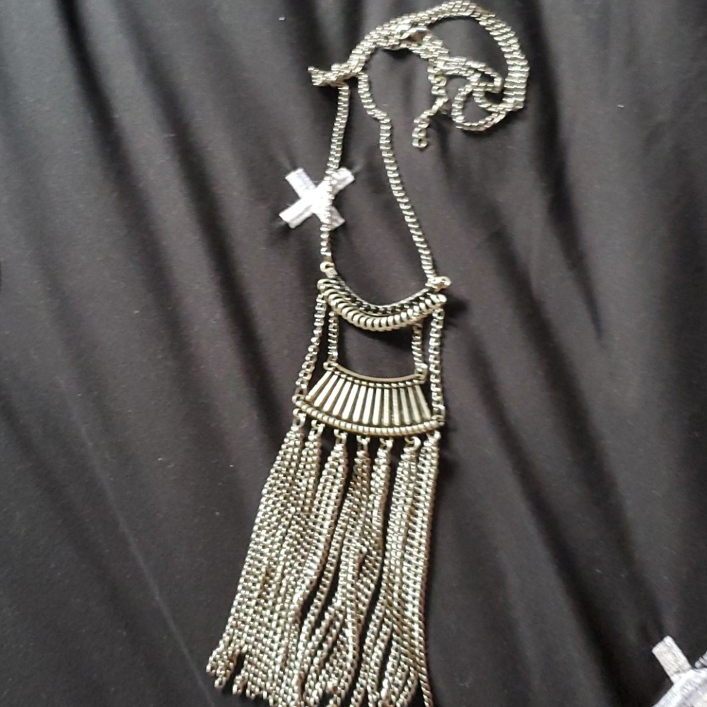 Long silver necklace.
